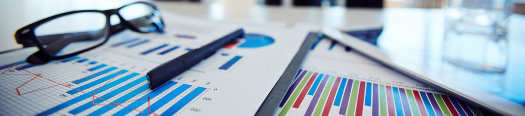 close up concept of graphs, facts and figures, saving money, business, managed print services