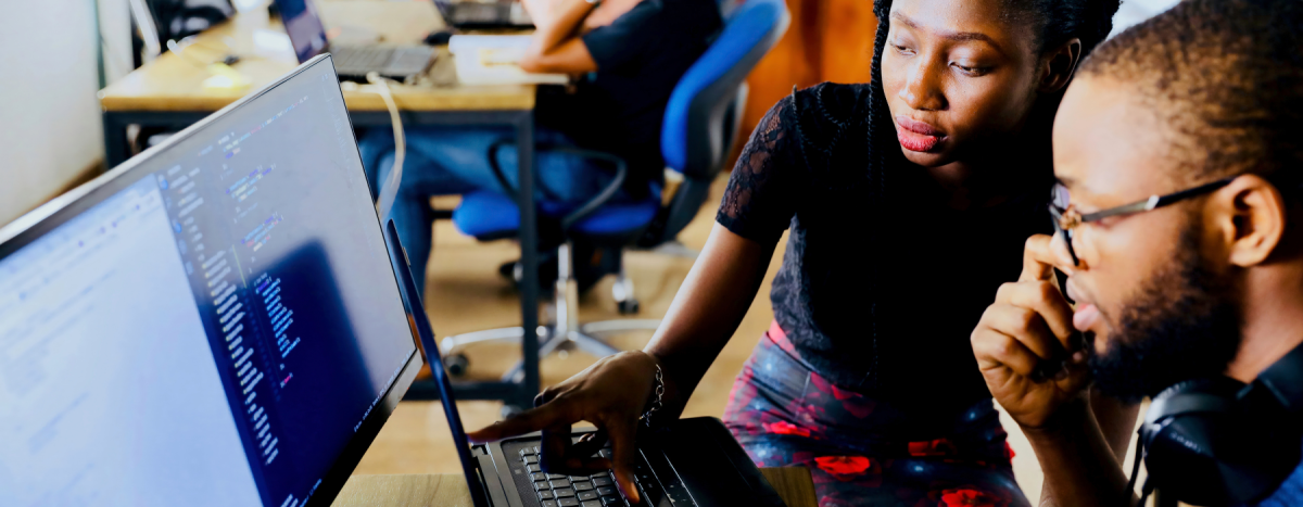 it professionals looking at computer screen