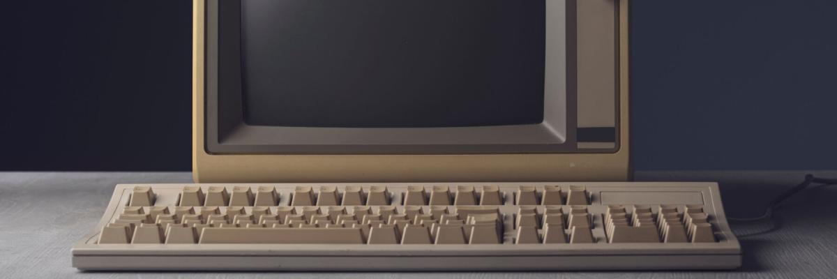 Vintage personal computer with keyboard on a desktop